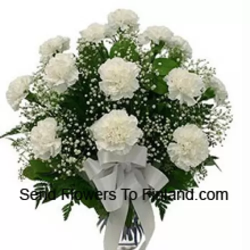 19 White Carnations With Seasonal Fillers In A Glass Vase