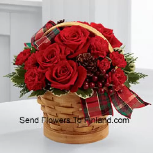 Greet your special recipient with seasonal beauty and blessings. Red roses and mini carnations are gorgeously arranged in a natural woodchip basket with assorted holiday greens, natural pinecones, and berry pics, accented with a tartan plaid ribbon to create a gift that wishes everything this wondrous season has to offer (Please Note That We Reserve The Right To Substitute Any Product With A Suitable Product Of Equal Value In Case Of Non-Availability Of A Certain Product)